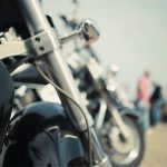 Retro bike closeup and people facing away