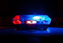 Woman charged with murder after house fire killed three